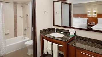 Designer toiletries, hair dryer, towels
