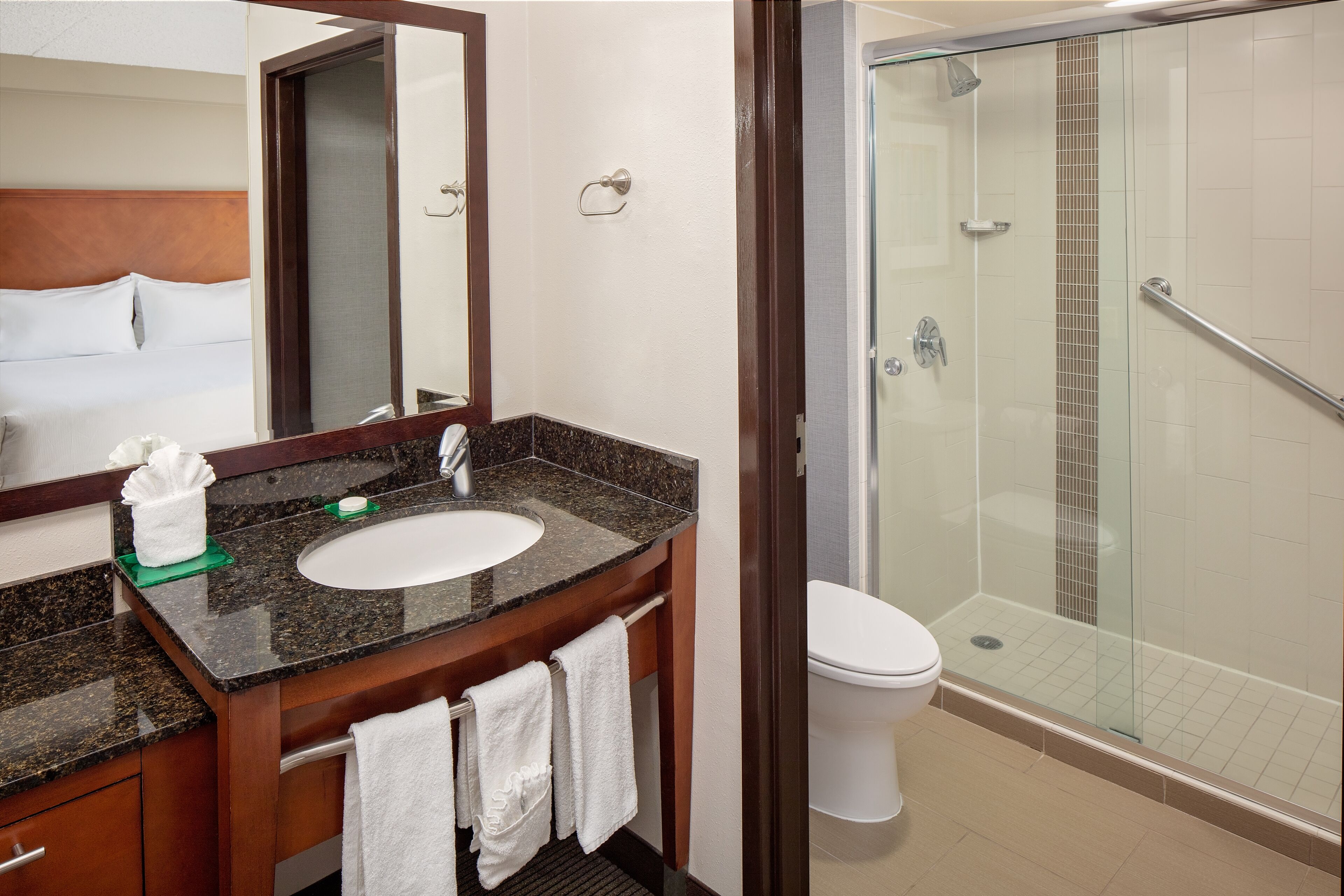 designer toiletries, hair dryer, towels