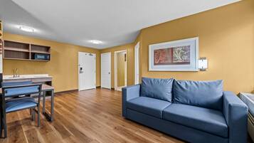 Suite, Non Smoking (1 Queen Bed) | Desk, laptop workspace, blackout curtains, iron/ironing board