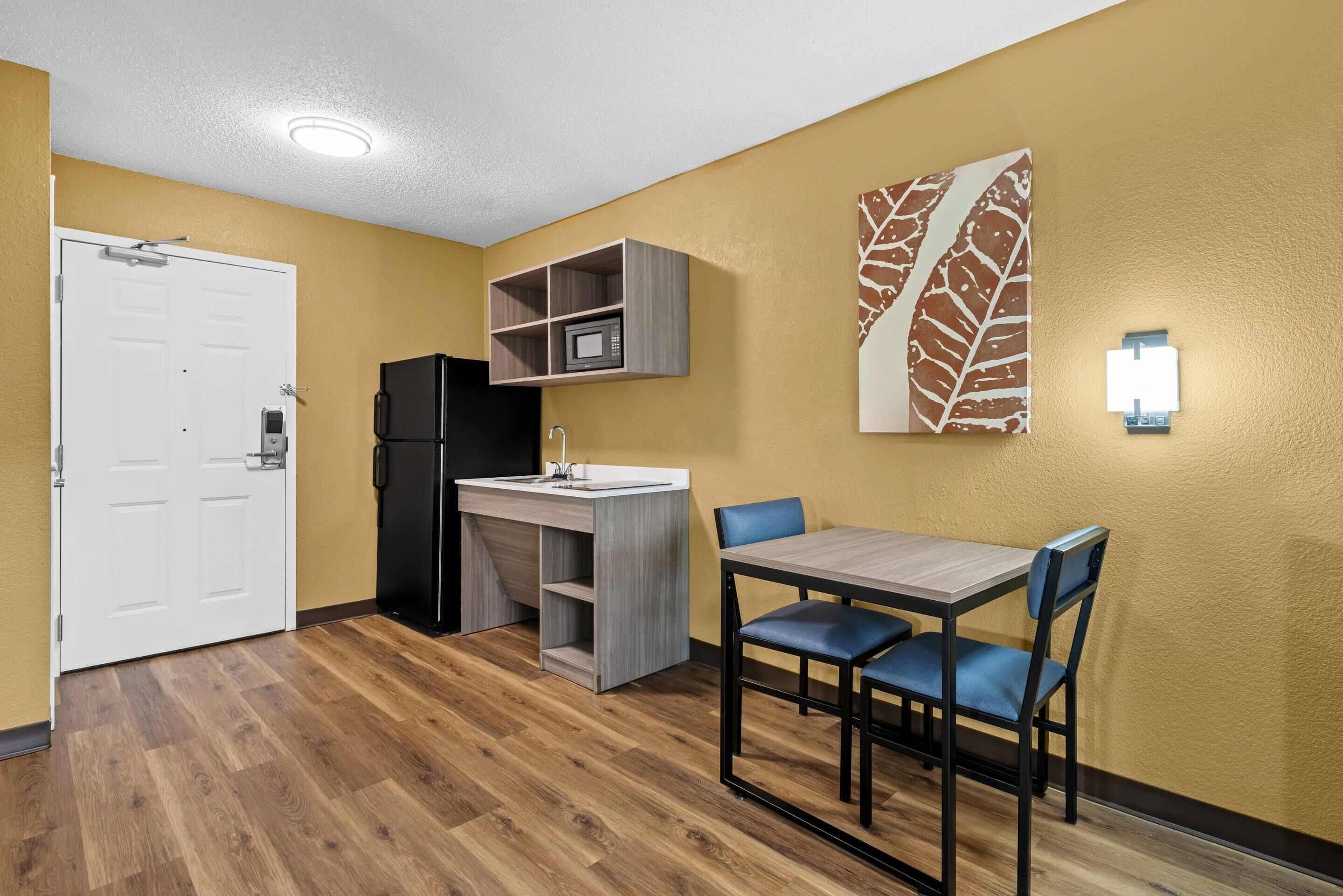 Desk, laptop workspace, blackout drapes, iron/ironing board