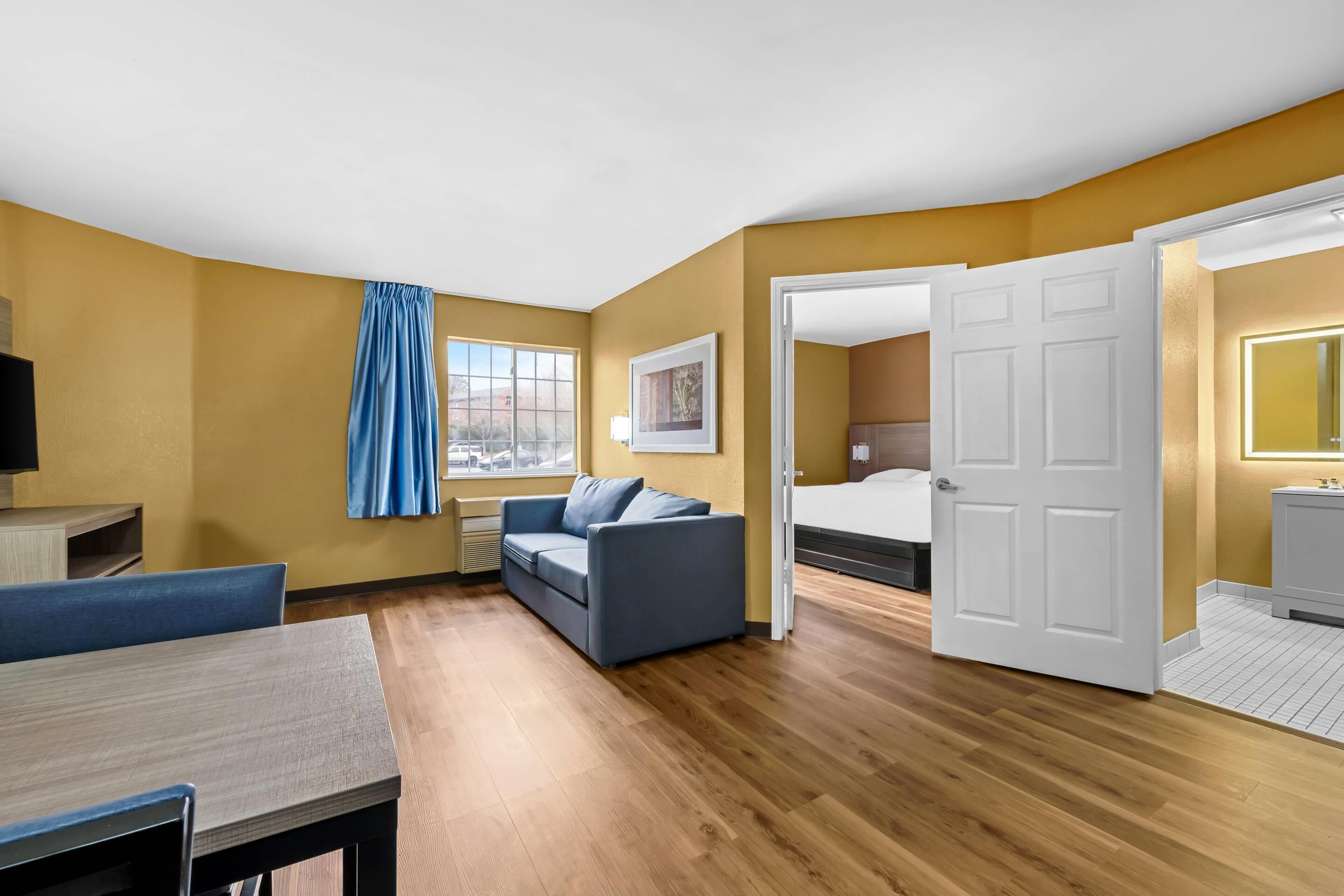 Desk, laptop workspace, blackout drapes, iron/ironing board