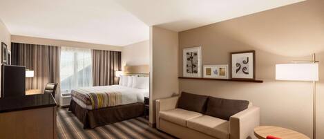 Premium bedding, desk, laptop workspace, blackout curtains