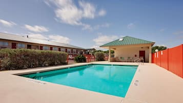 Seasonal outdoor pool, pool loungers