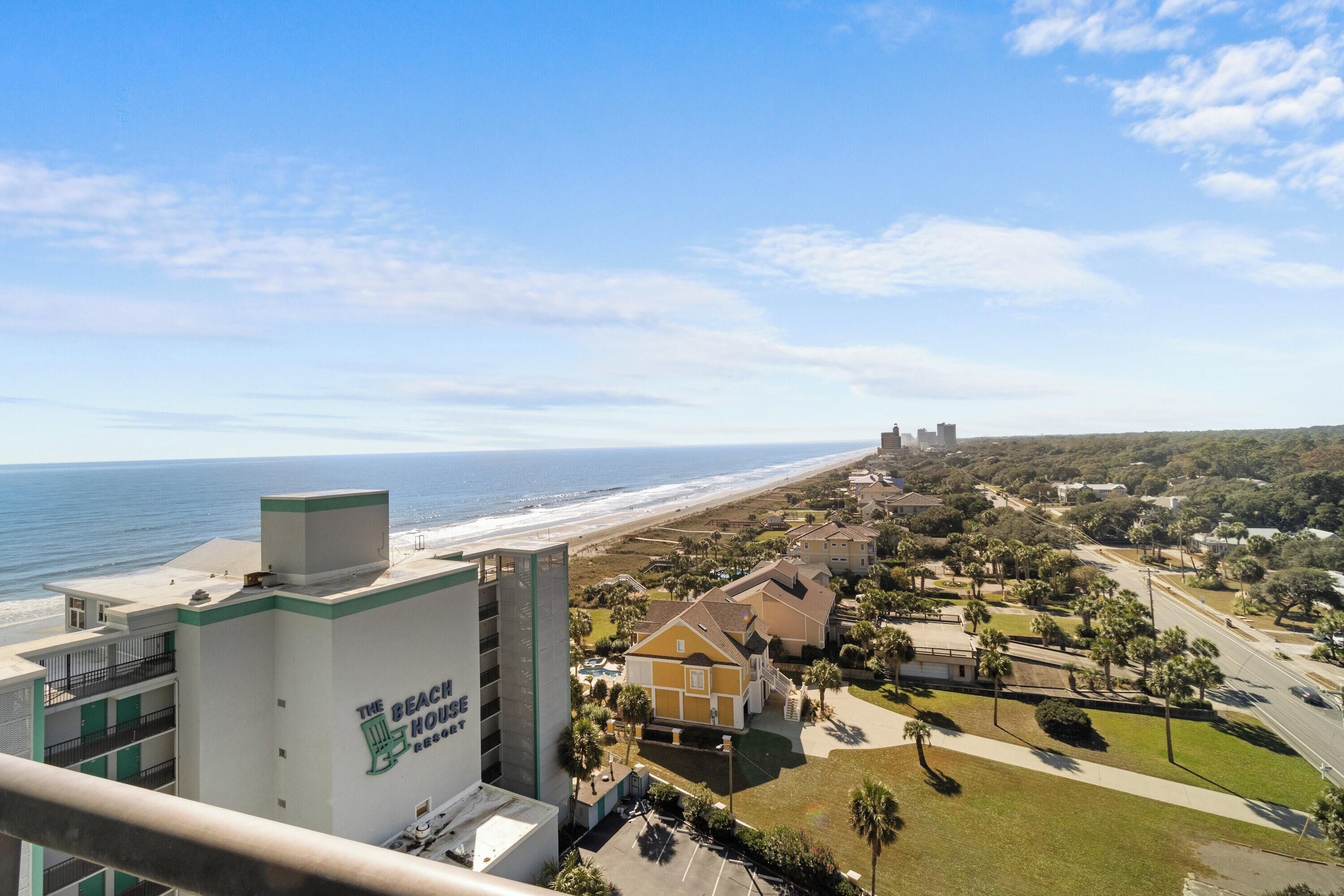 A coastal hotel with a view of the beach and ocean.