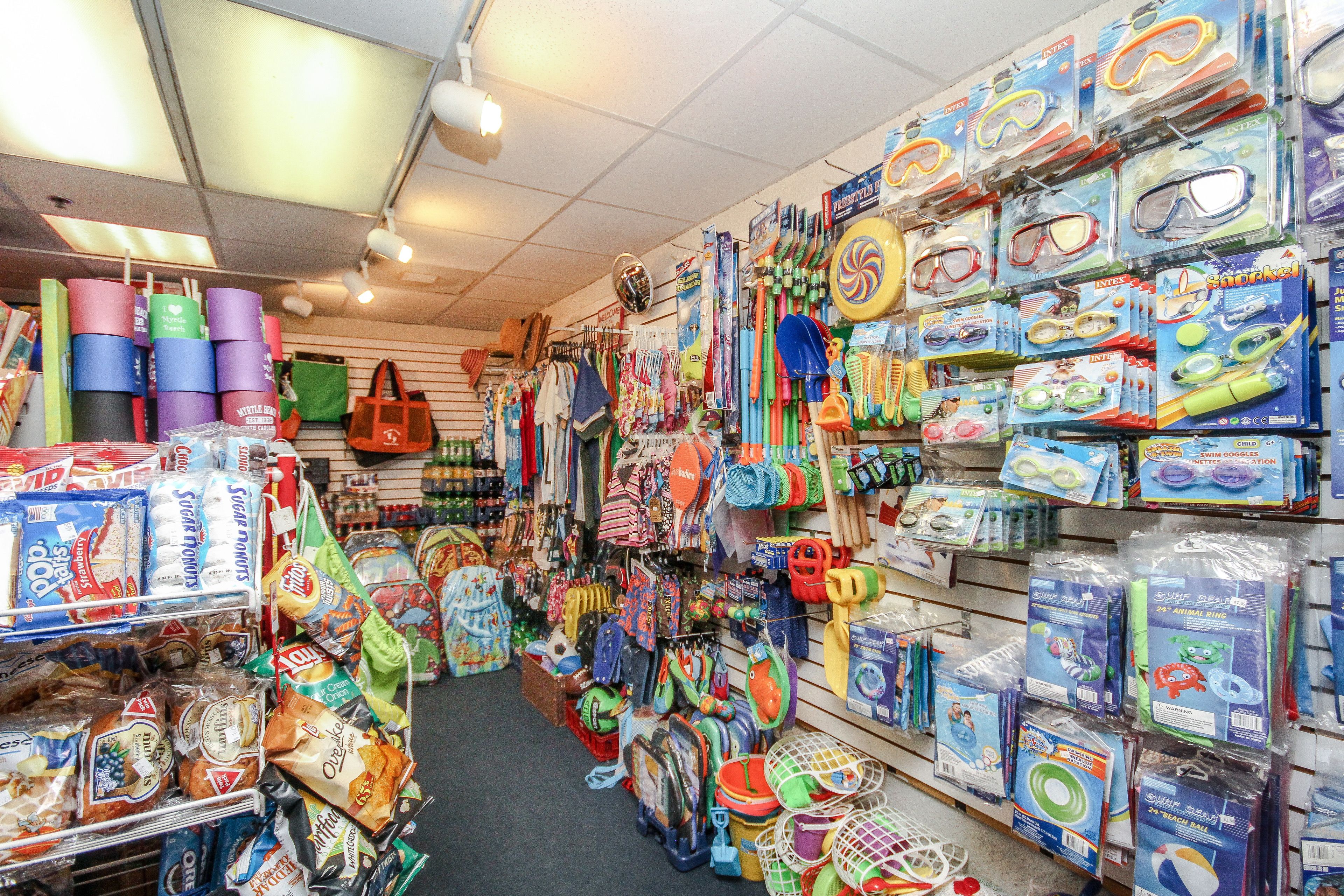 A store with shelves stocked with various children's toys and swimming gear.
