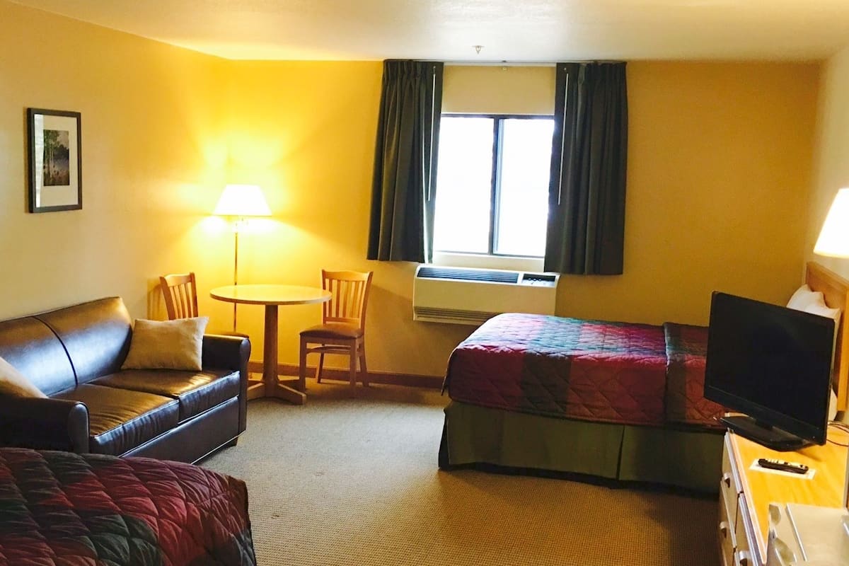 Premium bedding, desk, laptop workspace, blackout curtains