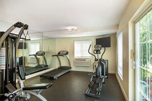 A gym with treadmills, an elliptical, and weight machines. - Best Western Clovis Cole (Clovis)