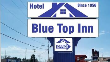 A hotel sign for Blue Top Inn, indicating it has been in operation since 1956.