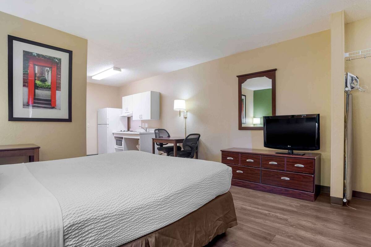 desk, laptop workspace, blackout curtains, iron/ironing board