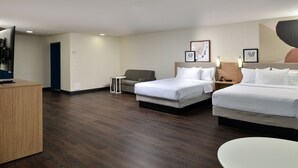 A hotel room with two beds, a desk, a chair, and a small table. - Spark by Hilton Dallas Medical District Love Field (Dallas)