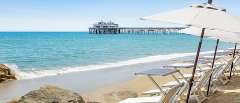 Private beach, white sand, sun loungers, beach umbrellas