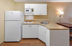 Full-size fridge, microwave, stovetop, coffee/tea maker