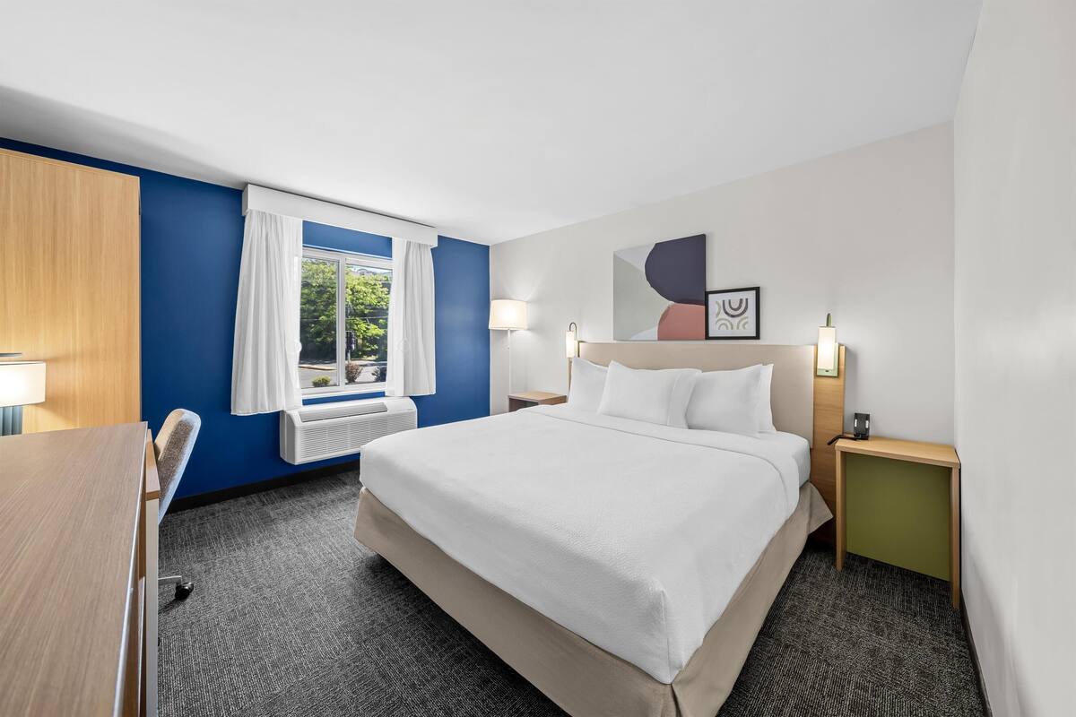 Room, 1 King Bed, Accessible (Mobility & Hearing, Roll-in Shower) | Pillowtop beds, desk, laptop workspace, blackout drapes