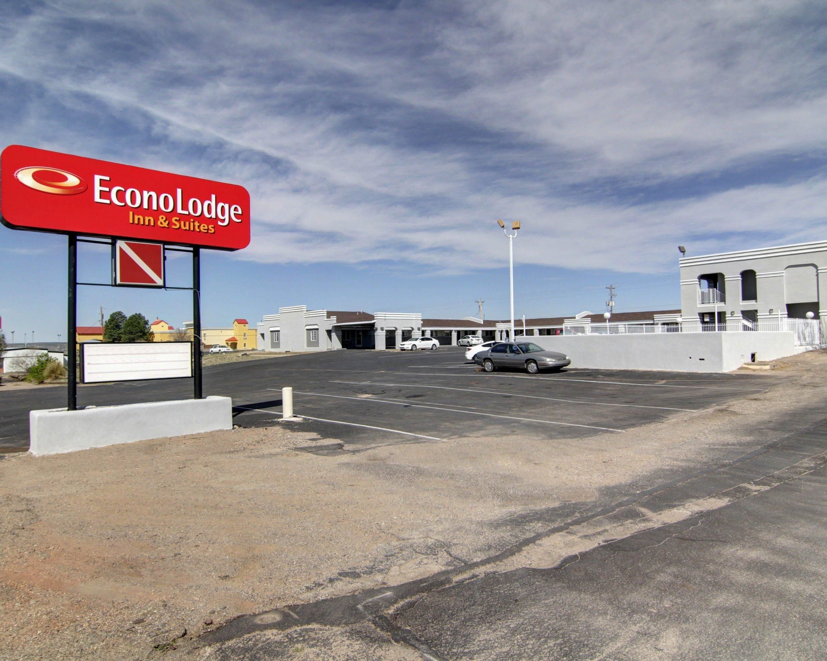 A parking lot with a sign for EconoLodge Inn & Suites.