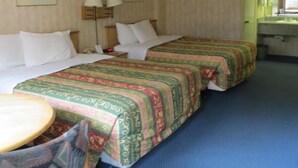 A hotel room with two beds, a desk, a chair, and a bathroom visible through an open door. - Grand Park Inn Anaheim Maingate (Anaheim)