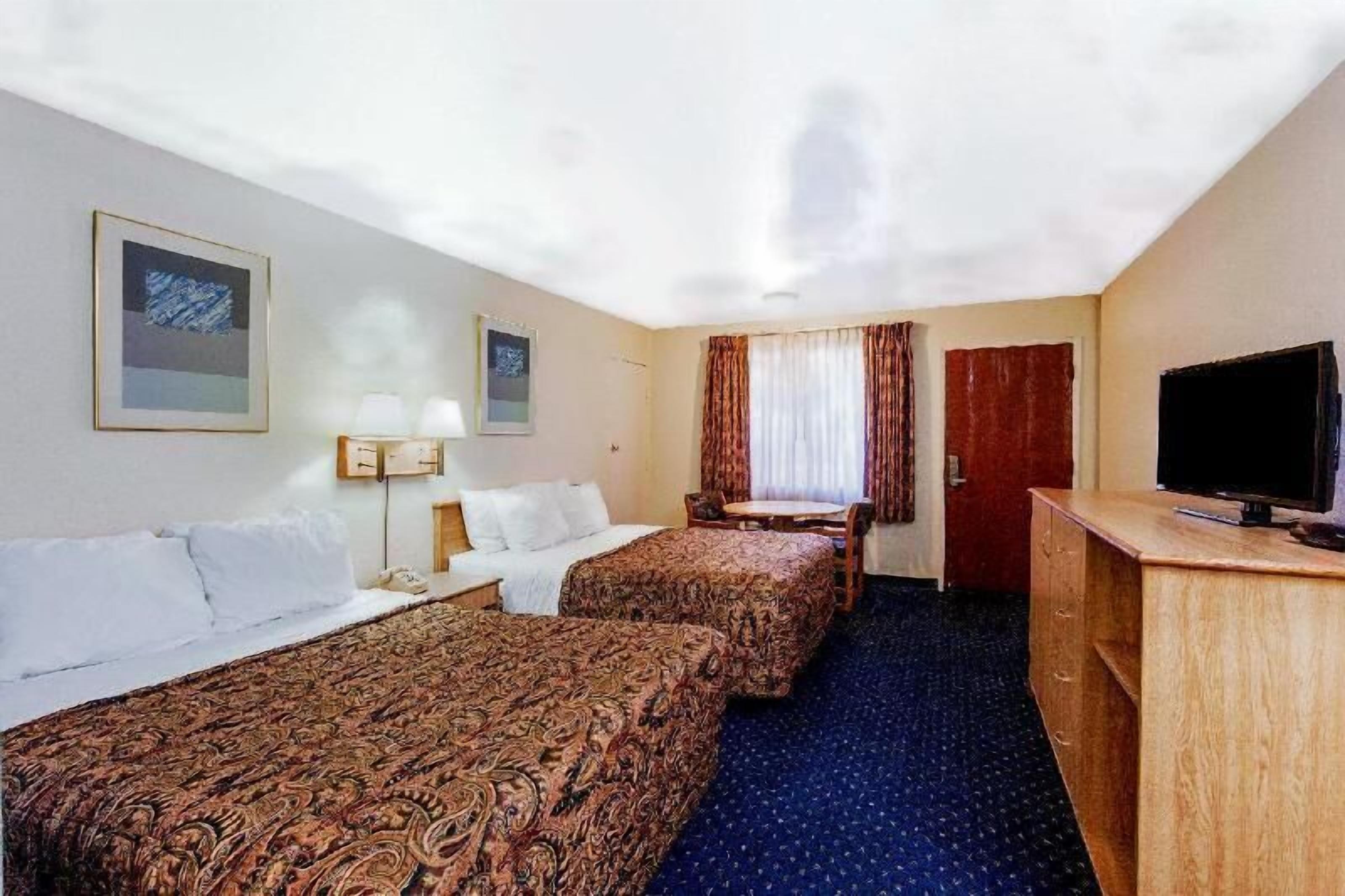 Down comforters, pillowtop beds, desk, laptop workspace