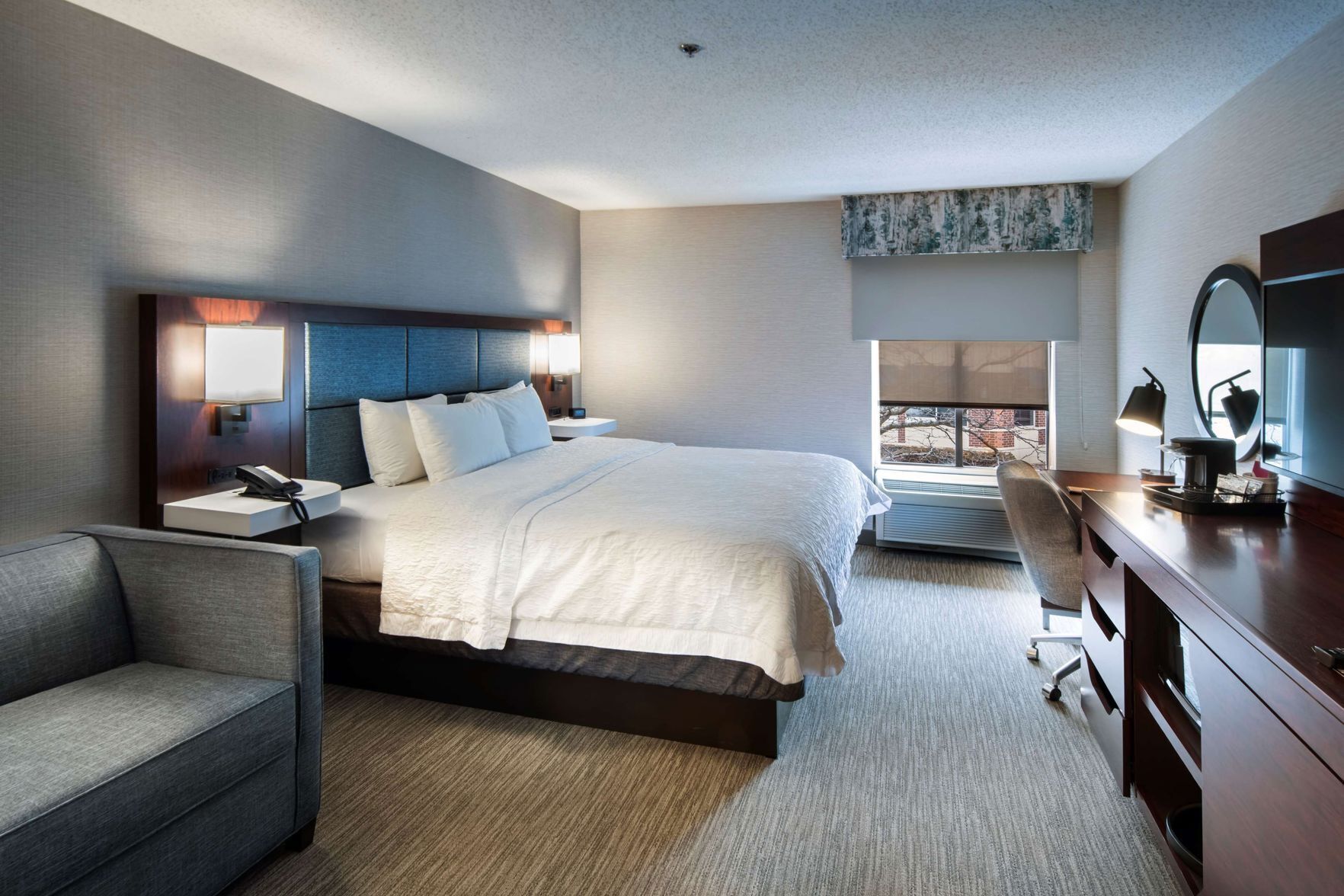 Hypo-allergenic bedding, desk, laptop workspace, blackout curtains
