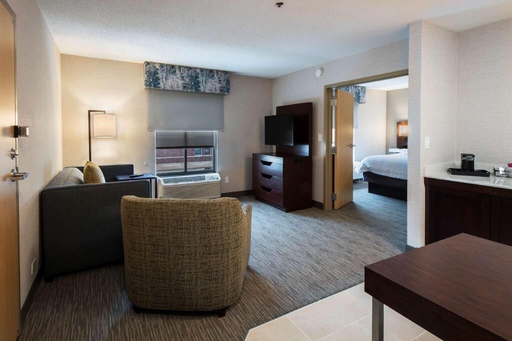 Hypo-allergenic bedding, desk, laptop workspace, blackout curtains