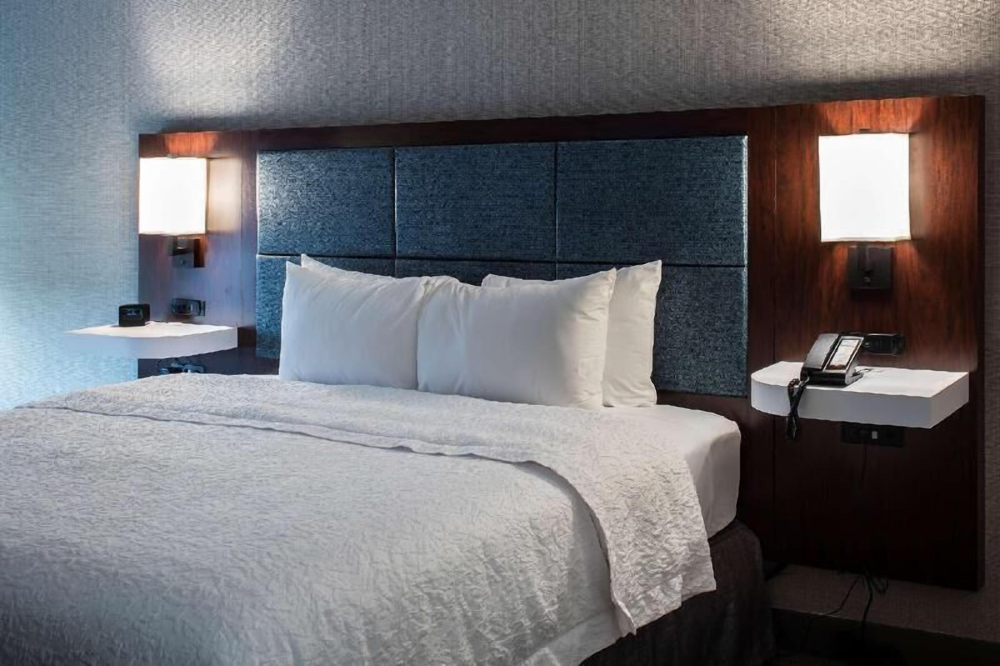 Hypo-allergenic bedding, desk, laptop workspace, blackout curtains