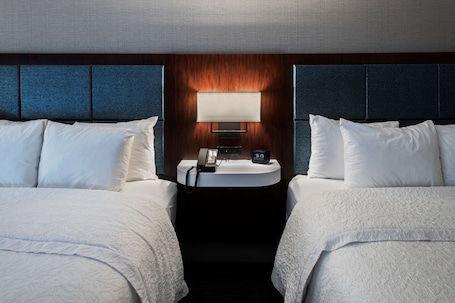 Hypo-allergenic bedding, desk, laptop workspace, blackout drapes