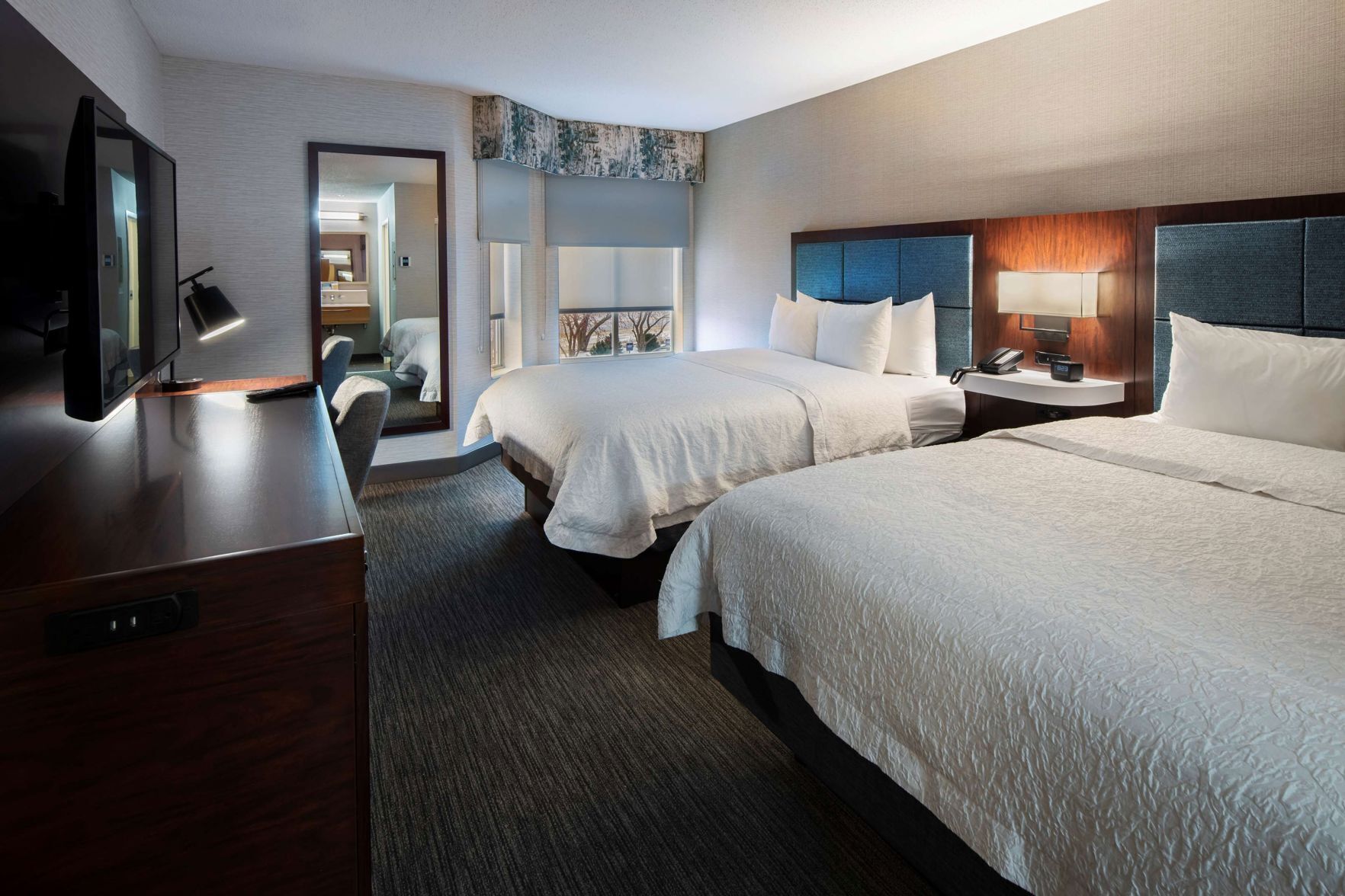 Hypo-allergenic bedding, desk, laptop workspace, blackout curtains