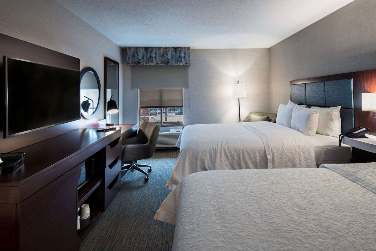 Hypo-allergenic bedding, desk, laptop workspace, blackout drapes