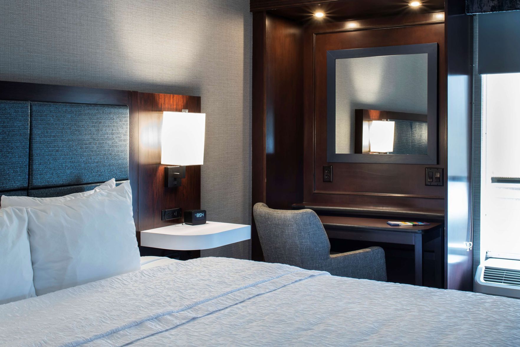 Hypo-allergenic bedding, desk, laptop workspace, blackout curtains