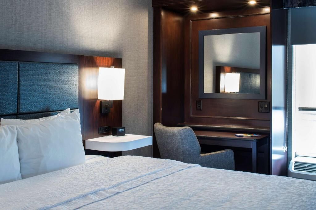 Hypo-allergenic bedding, desk, laptop workspace, blackout curtains