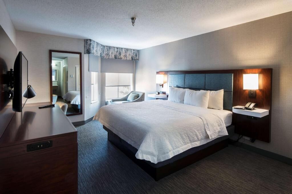 Hypo-allergenic bedding, desk, laptop workspace, blackout curtains