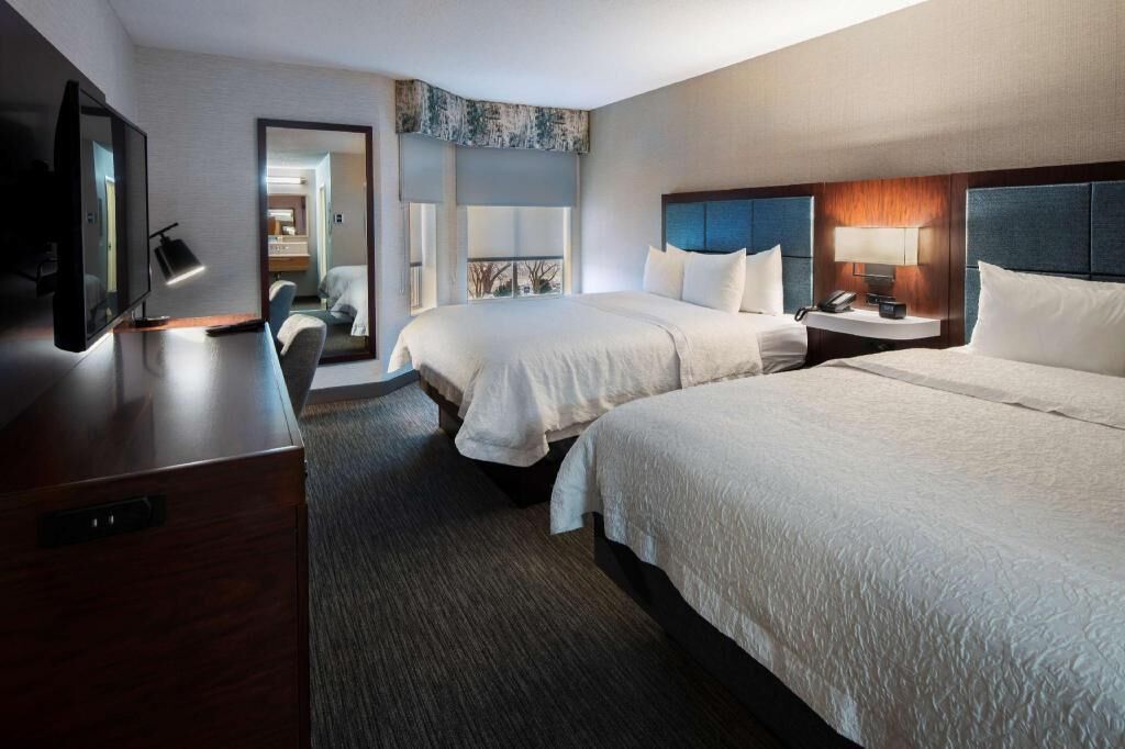 Hypo-allergenic bedding, desk, laptop workspace, blackout curtains