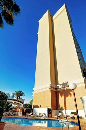 Outdoor pool, open 7:00 AM to 11:00 PM, pool loungers