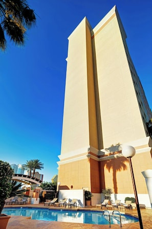 Outdoor pool, open 7:00 AM to 11:00 PM, pool loungers
