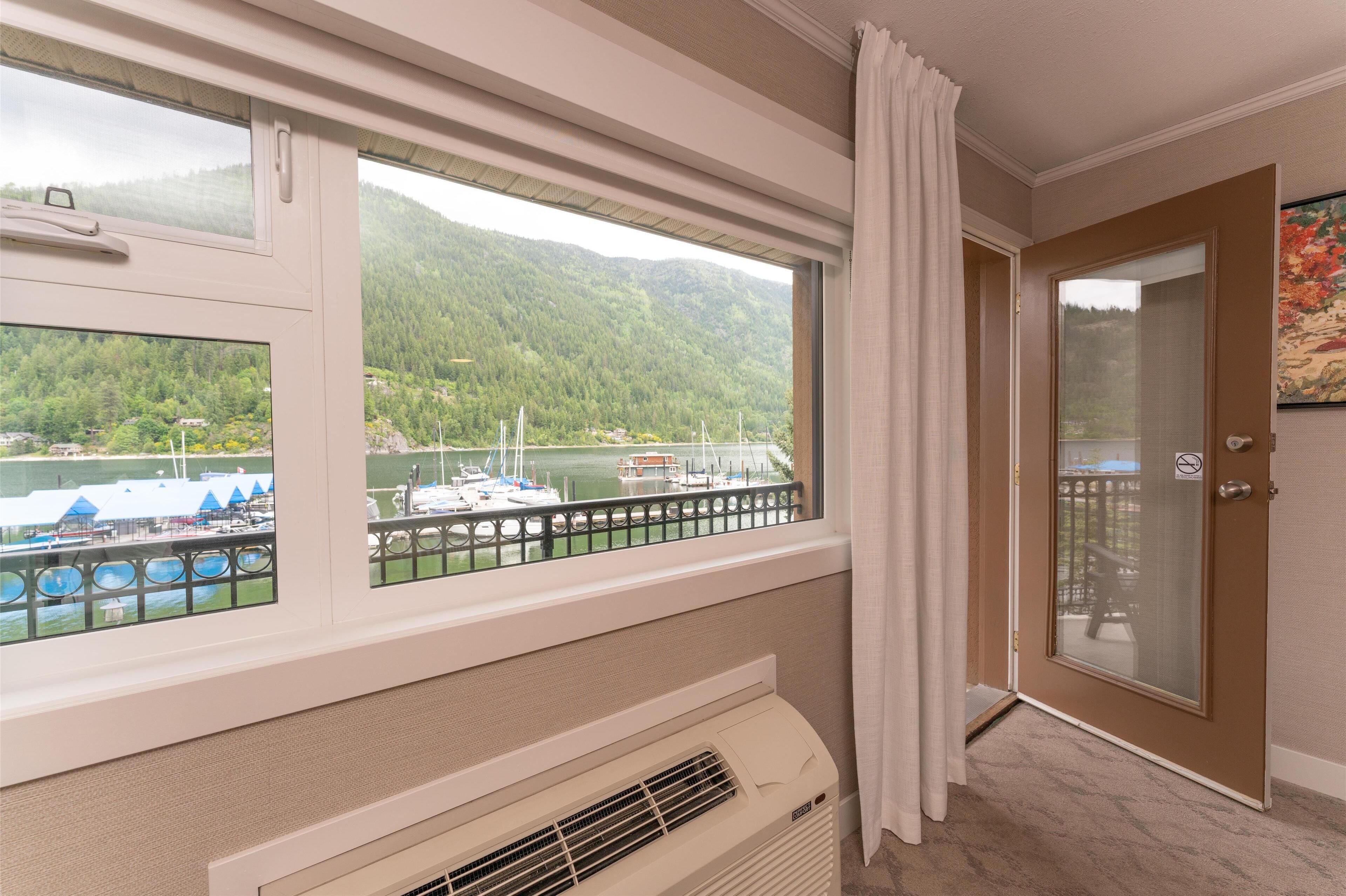 standard room, 2 queen beds, non smoking, lake view | 1 bedroom, in-room safe, iron/ironing board, cots/infant beds