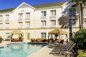 Outdoor pool, open 7:00 AM to 10:00 PM, pool umbrellas, pool loungers