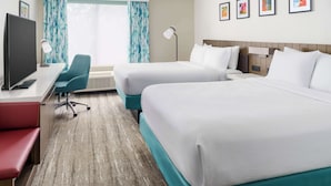 A hotel room with two beds, a desk with a computer, a chair, and a TV. - Hilton Garden Inn Lake Mary (Lake Mary)