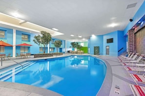 Indoor pool, open 9:00 AM to 9:00 PM, pool umbrellas, pool loungers