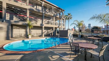 Seasonal outdoor pool, pool umbrellas, pool loungers