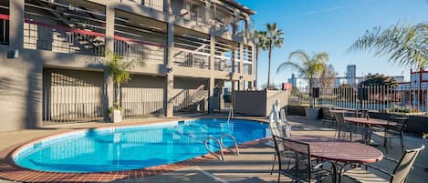 Seasonal outdoor pool, pool umbrellas, pool loungers