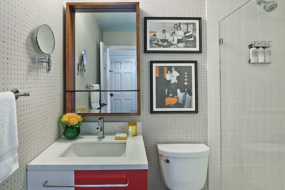 designer toiletries, hair dryer, towels