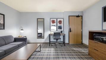 Suite, 1 King Bed, Non Smoking (One-Bedroom Not Pet Friendly) | Desk, iron/ironing board, travel crib, free WiFi