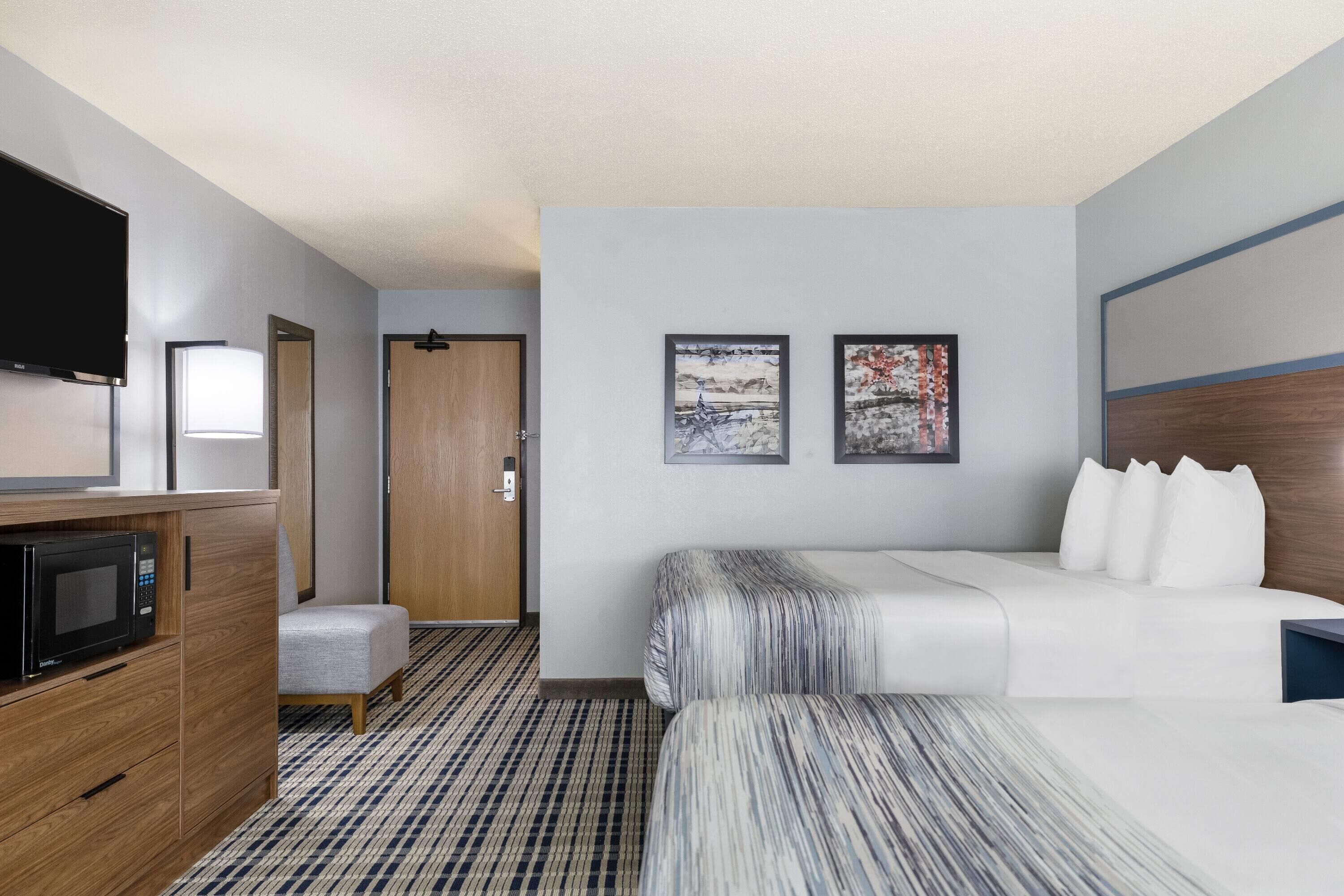 Room, 2 Queen Beds, Non Smoking (Pet Friendly) | Desk, iron/ironing board, travel crib, free WiFi