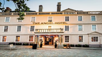 A building with a sign reading "The Angel Hotel".