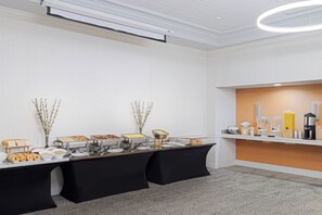 A buffet setup with various food items and a coffee station. - EVEN Hotel Sarasota-Lakewood Ranch by IHG (Sarasota)