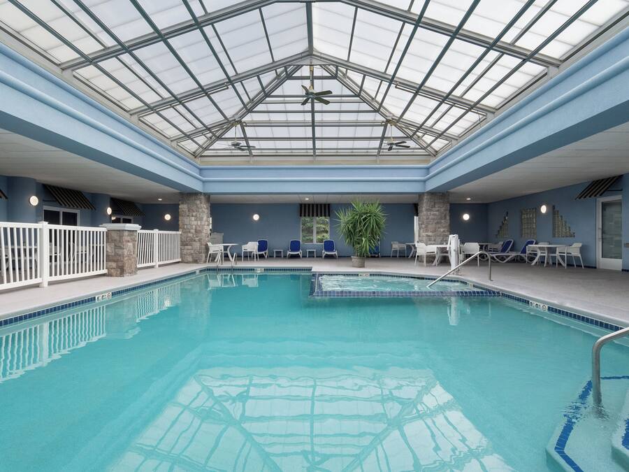 Indoor pool, open 10:00 AM to 11:00 PM, pool loungers