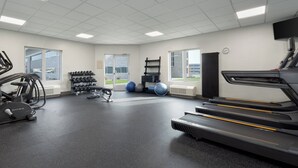 A gym with treadmills, exercise balls, and dumbbells. - Holiday Inn Express Hotel & Suites Saginaw by IHG (Saginaw)