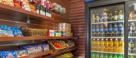 A snack and beverage display with various packaged snacks and drinks, including Pepsi.