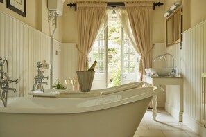 Garden Suite | Bathroom | Designer toiletries, hair dryer, bathrobes, slippers