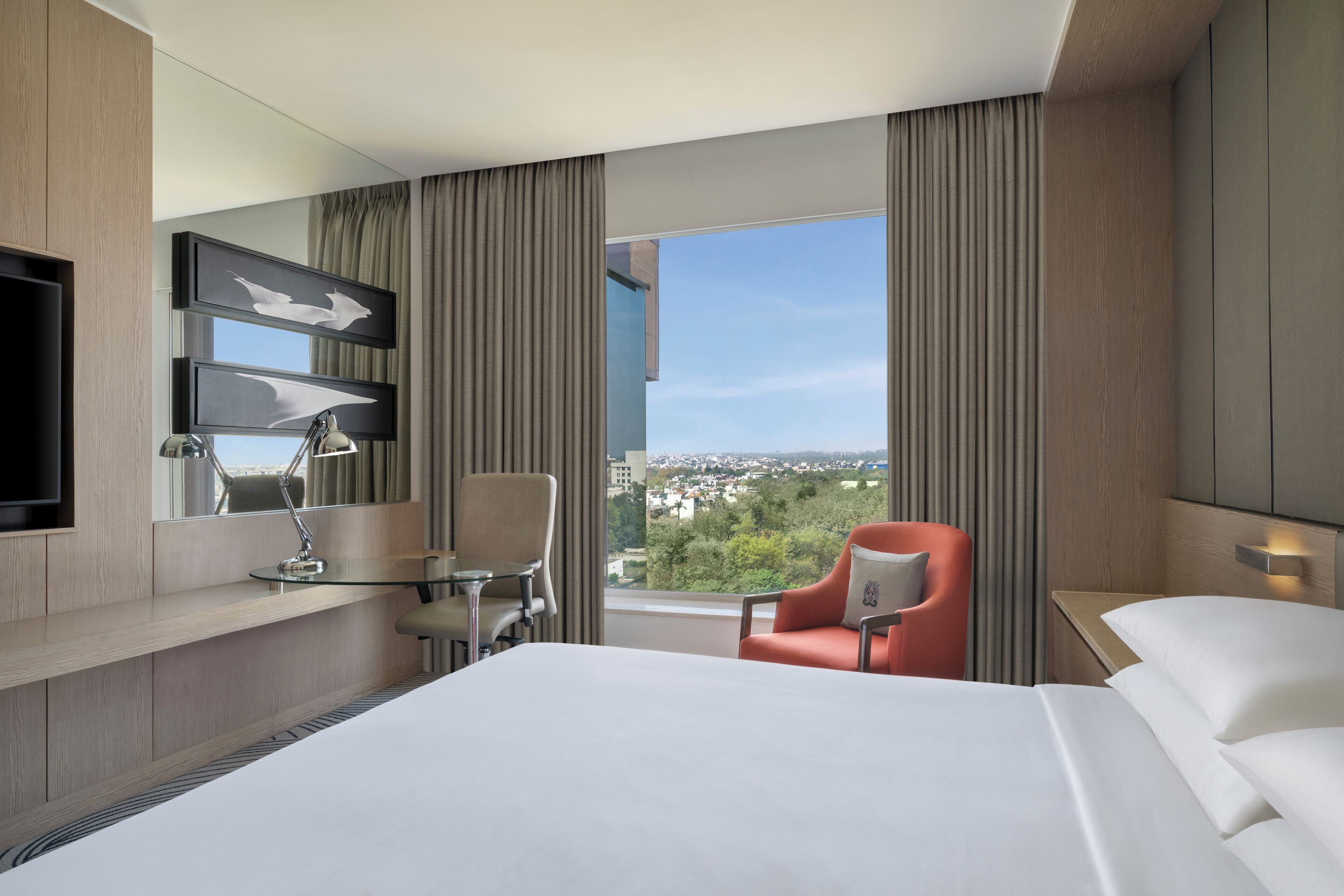 deluxe room, 1 king bed, non smoking, city view | premium bedding, minibar, in-room safe, individually furnished