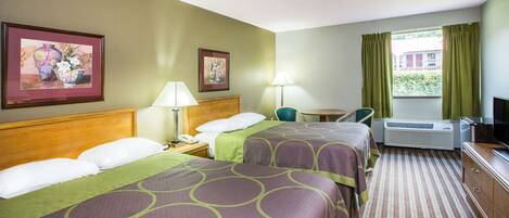 A hotel room with two beds, a desk, a chair, a TV, and a window with curtains.