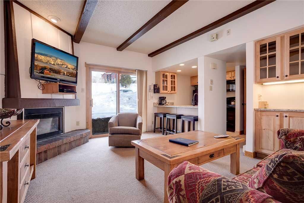 Condo, 1 King Bed with Sofa bed, Mountain View (Rockies Condominiums - R2205) | Living room | TV, fireplace